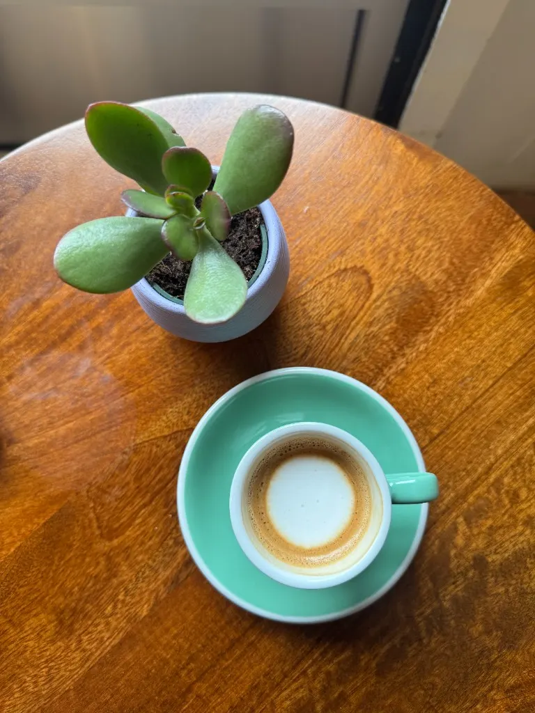 Sesame seed croissant on a vintage floral plate