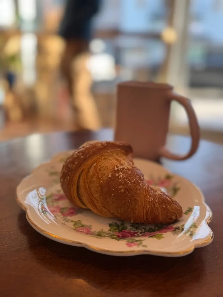 Chocolate chunk cookies stacked in the pastry case